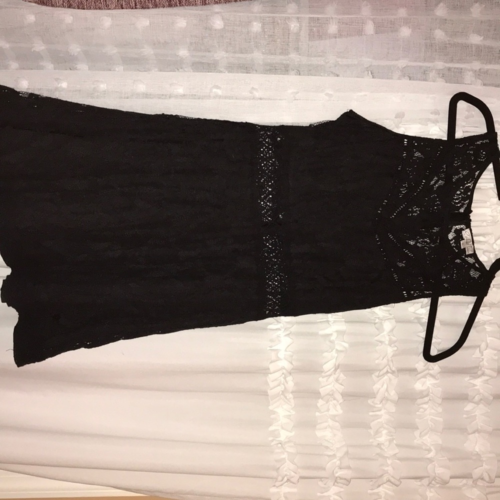 Black lace dress. Midriff shows with classy lace